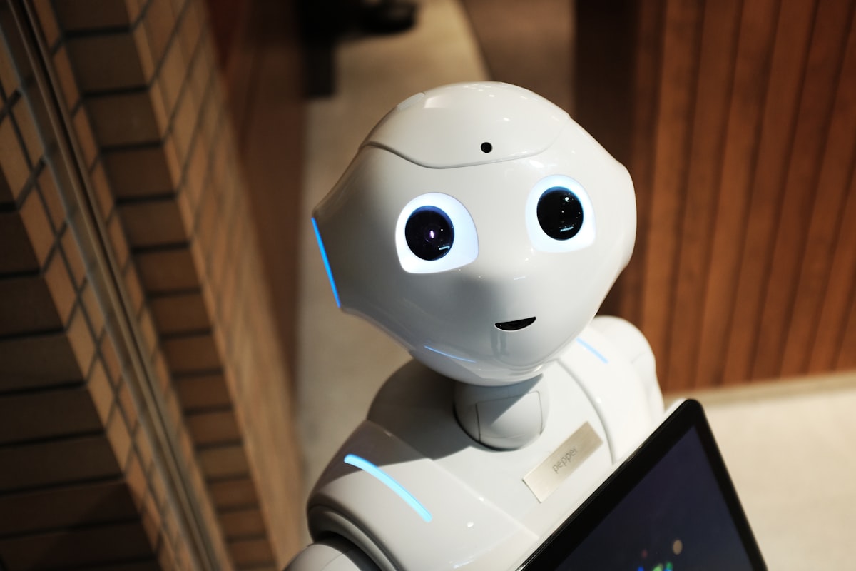 A robot hand and a human hand reaching toward each other